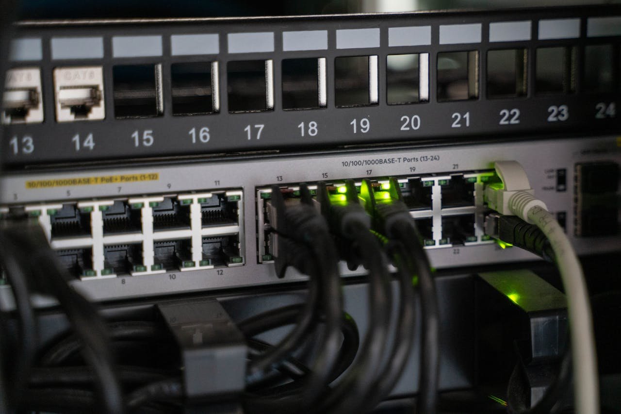 Services Networking equipment with connected cables, showcasing modern technology infrastructure.