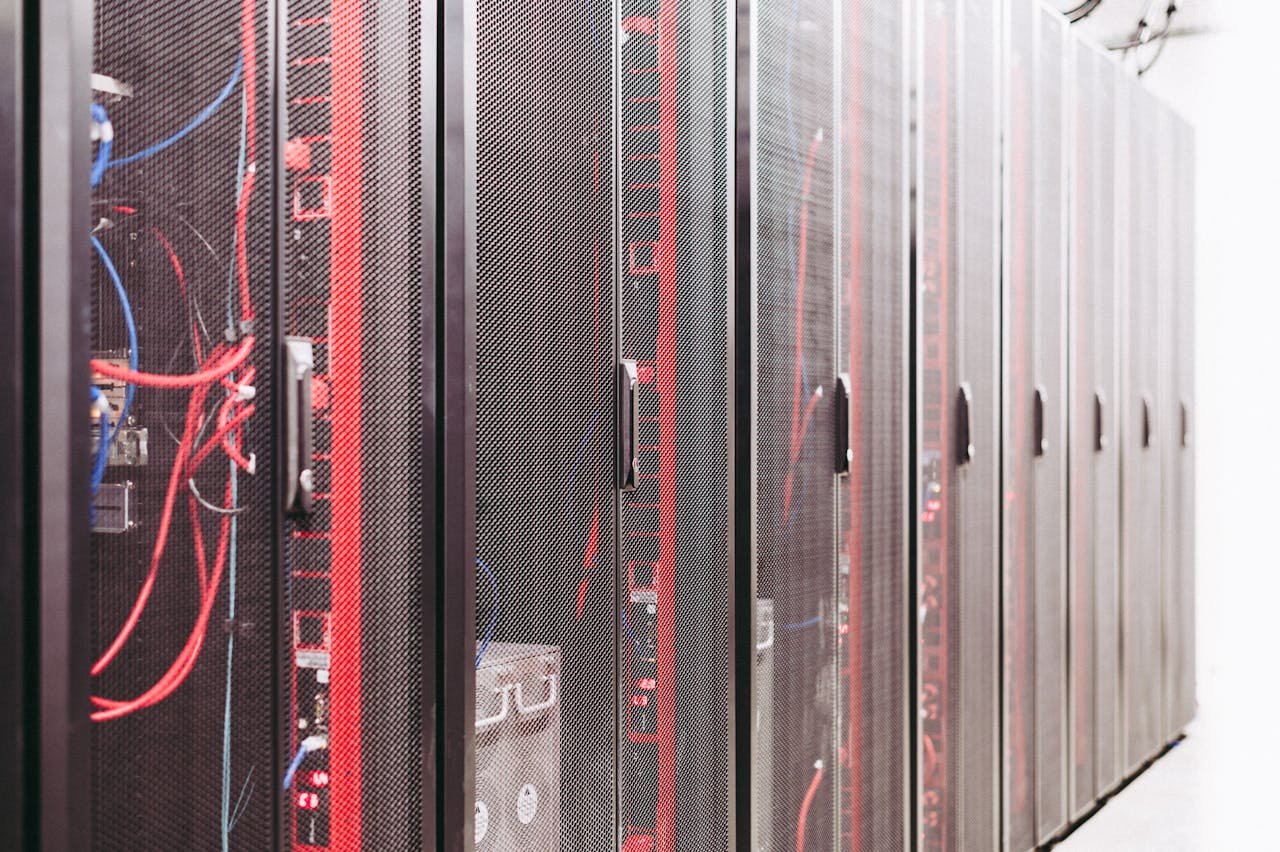 Services Modern data server room with network racks and cables.